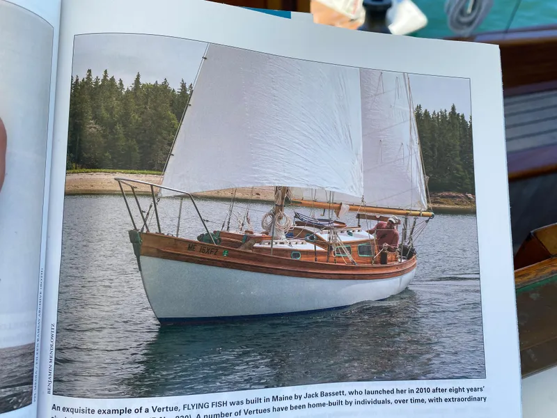 Slide: The Image of Laurent Giles Vertue Class Sloop, 2010, sailing on calm waters near a forested shoreline. - 46