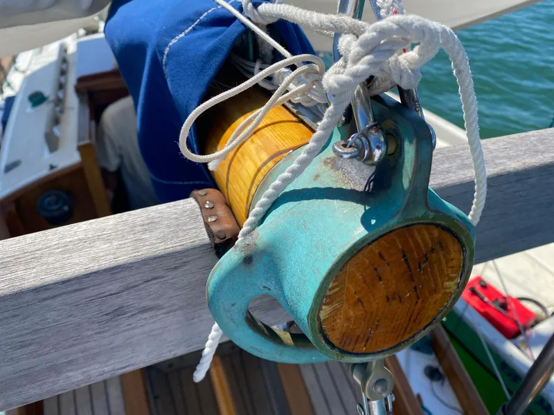 Slide: The Image of Close-up of Laurent Giles Vertue Class Sloop rigging, showcasing detailed craftsmanship, 2010 model. - 49