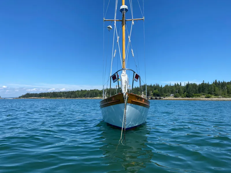 Slide: The Image of Laurent Giles Vertue Class Sloop, 2010, sailing on calm waters with a clear blue sky. - 5