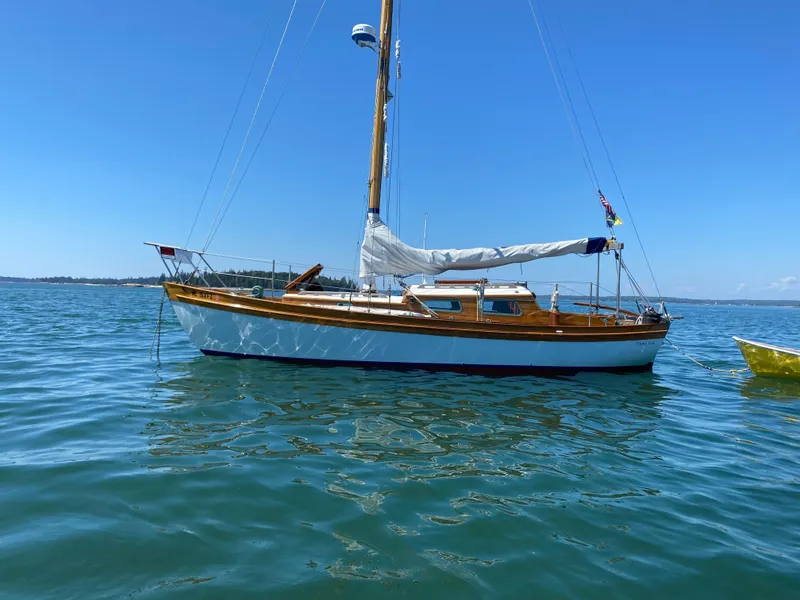 Slide: The Image of Laurent Giles Vertue Class Sloop, 2010, sailing on calm blue waters under clear skies. - 6