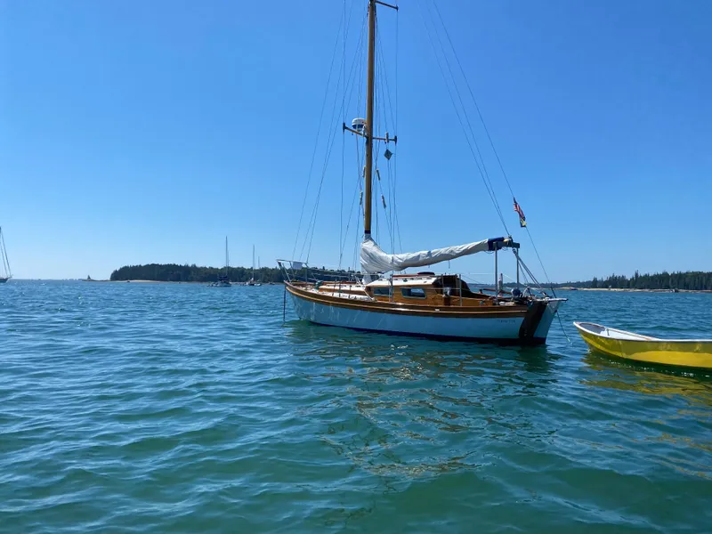 Slide: The Image of Laurent Giles Vertue Class Sloop, 2010, sailing on calm blue waters under clear sky. - 7