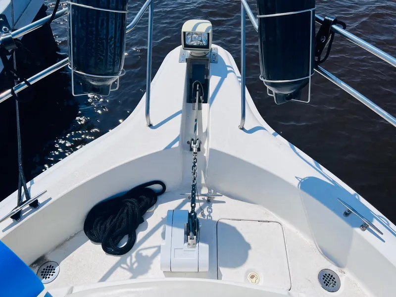 Slide: The Image of Bow of 1999 Silverton 392 Motor Yacht with anchor and rope. - 16