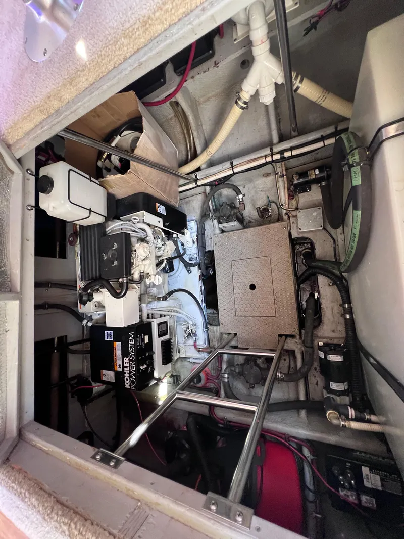 Slide: The Image of Engine room of a 1999 Silverton 392 Motor Yacht, featuring Kohler power system. - 25