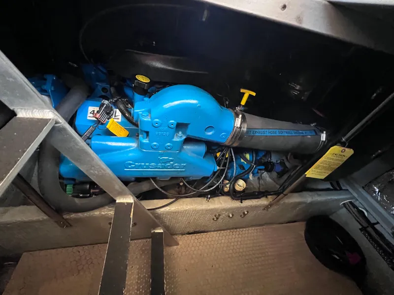 Slide: The Image of Engine compartment of a 1999 Silverton 392 Motor Yacht with blue Crusader engine. - 26