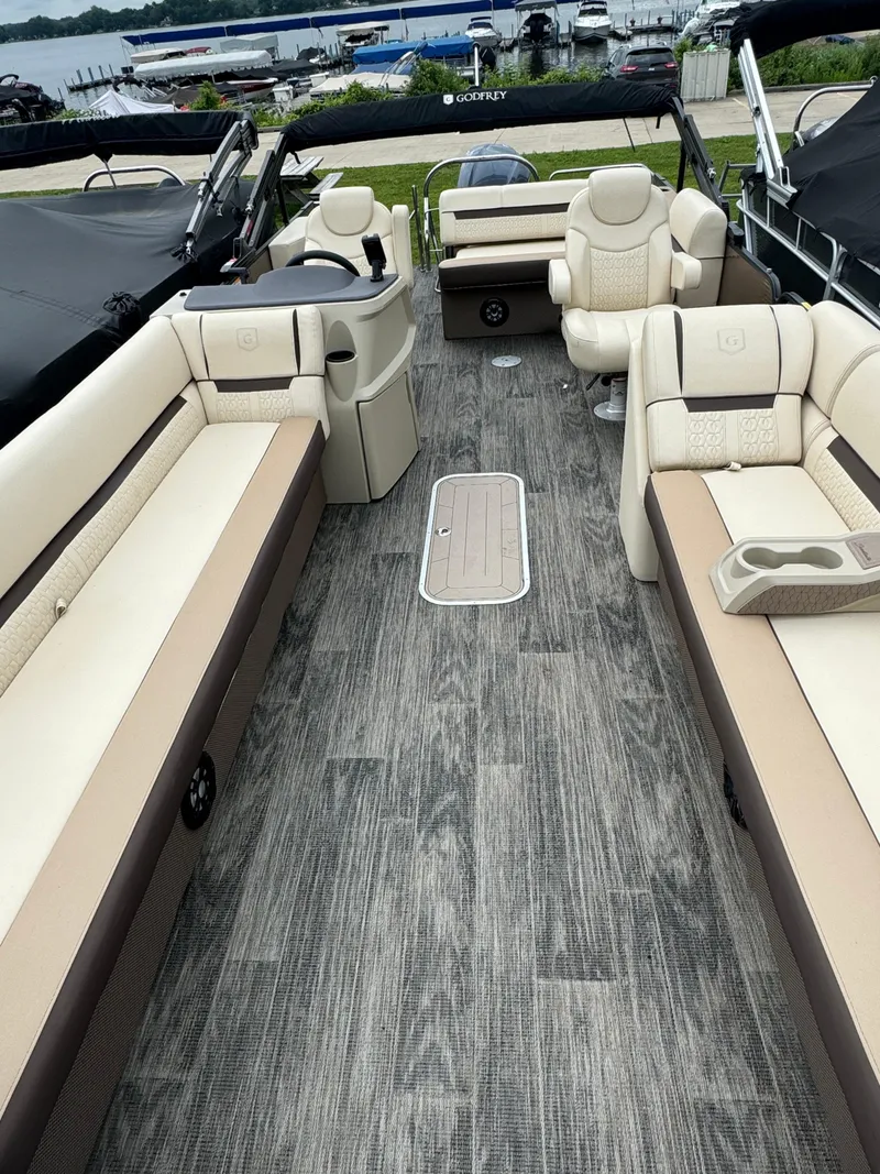 Slide: The Image of 2023 Sweetwater 2486 SFLC pontoon boat interior with luxurious seating and modern design. - 3