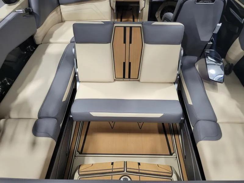 Slide: The Image of 2022 Supra SR400 boat interior with beige and gray seating. - 10