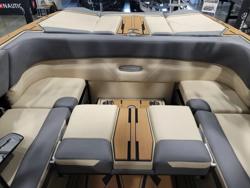 Slide: The Image of 2022 Supra SR400 boat interior with luxurious seating and wood accents. - 11