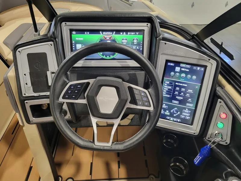 Slide: The Image of 2022 Supra SR400 boat dashboard with advanced touchscreen controls and steering wheel. - 12