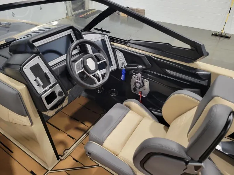 Slide: The Image of 2022 Supra SR400 boat interior with modern dashboard and steering wheel. - 14