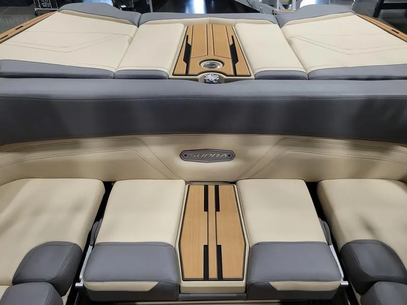 Slide: The Image of 2022 Supra SR400 boat interior with beige and gray seating. - 15