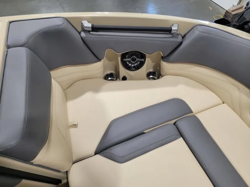 Slide: The Image of 2022 Supra SR400 boat interior with beige and gray seating. - 17