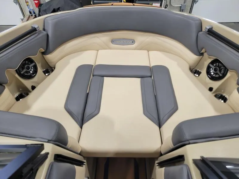 Slide: The Image of 2022 Supra SR400 boat interior with beige and gray seating. - 20