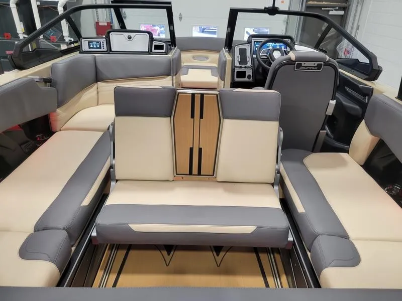 Slide: The Image of Interior of a 2022 Supra SR400 boat with beige and gray seating. - 21