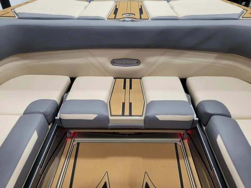 Slide: The Image of 2022 Supra SR400 boat interior with beige and gray seating. - 23