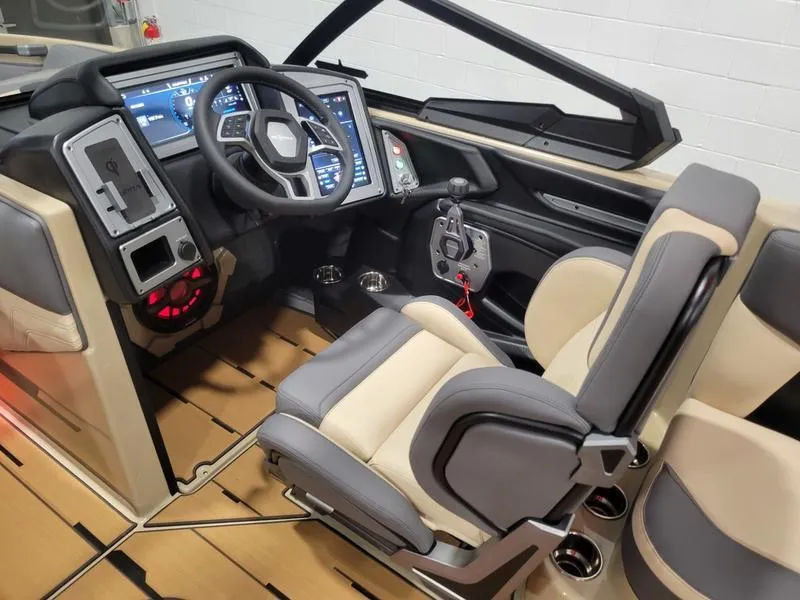 Slide: The Image of 2022 Supra SR400 boat cockpit with advanced controls and luxurious seating. - 26