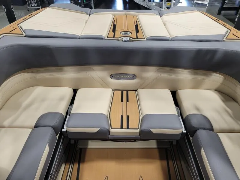 Slide: The Image of 2022 Supra SR400 boat interior with beige and gray seating. - 27