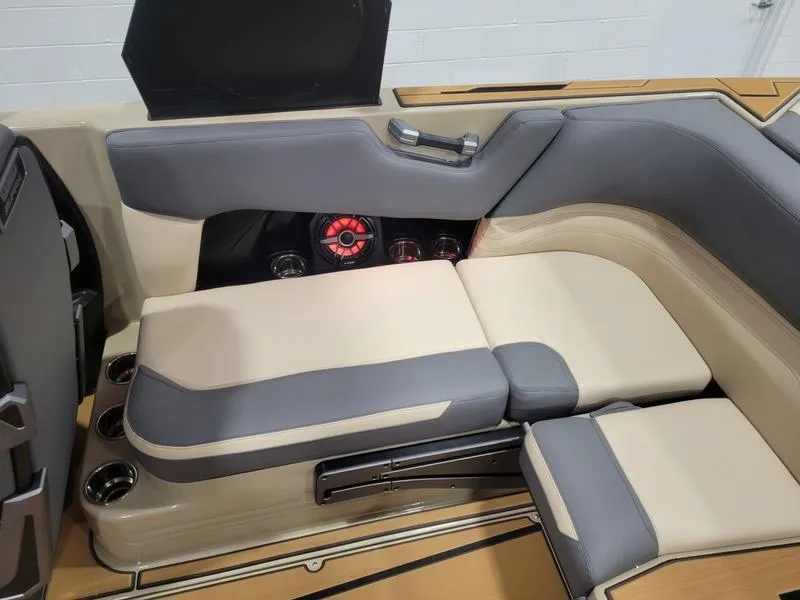 Slide: The Image of 2022 Supra SR400 boat interior with beige and gray seating. - 34