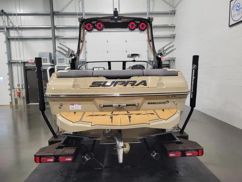 Slide: The Image of 2022 Supra SR400 boat in a showroom, rear view with wakeboard tower. - 39