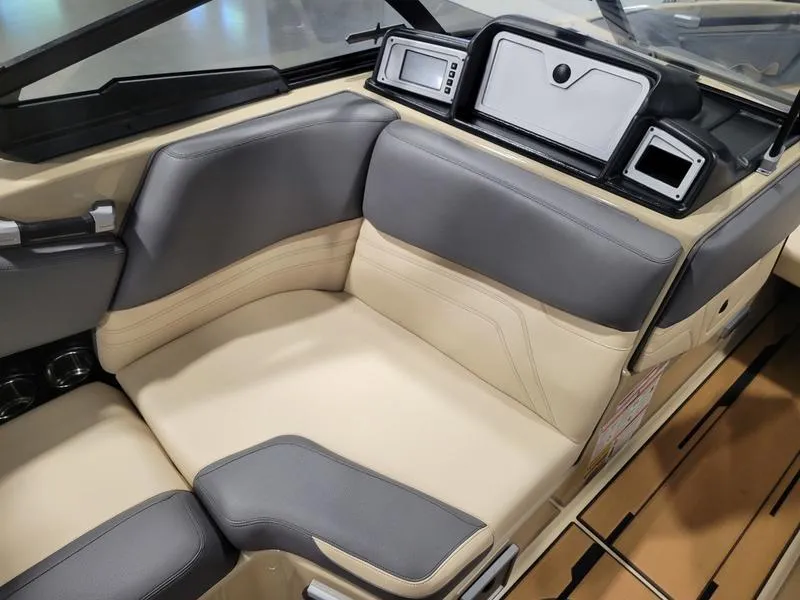Slide: The Image of 2022 Supra SR400 boat interior with beige and gray seating. - 9