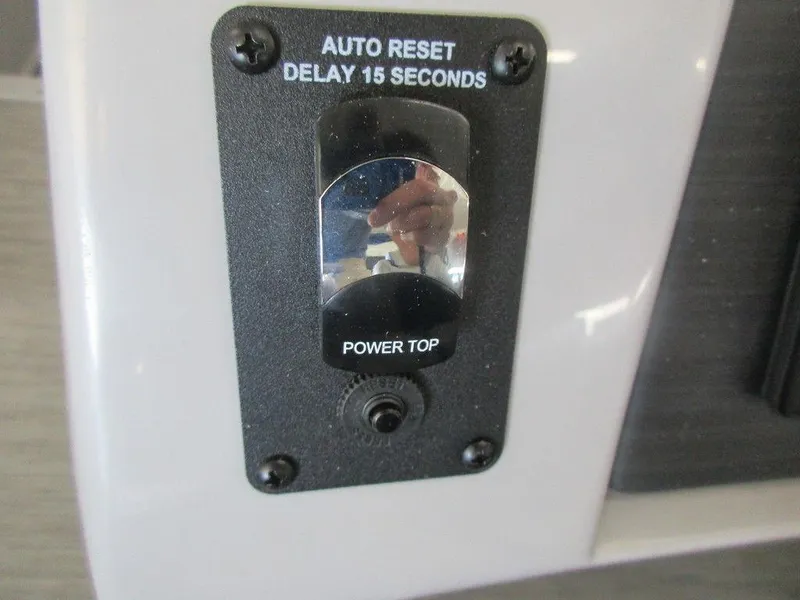Slide: The Image of 2023 Bennington 25 LTSB power top auto reset switch. - 19