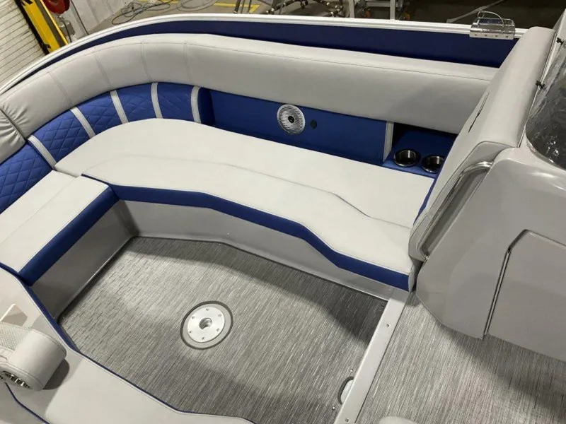 Slide: The Image of 2023 Bennington 25 LTSB boat interior with white and blue seating. - 21