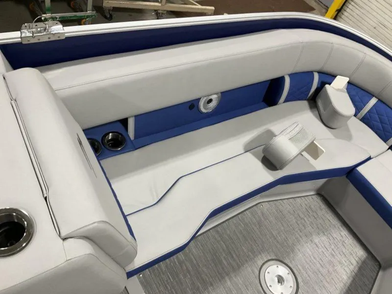 Slide: The Image of 2023 Bennington 25 LTSB boat interior with white and blue seating. - 3
