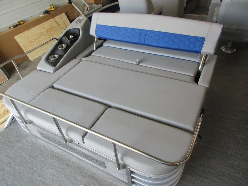 Slide: The Image of 2023 Bennington 25 LTSB boat interior with cushioned seating and cup holders. - 4