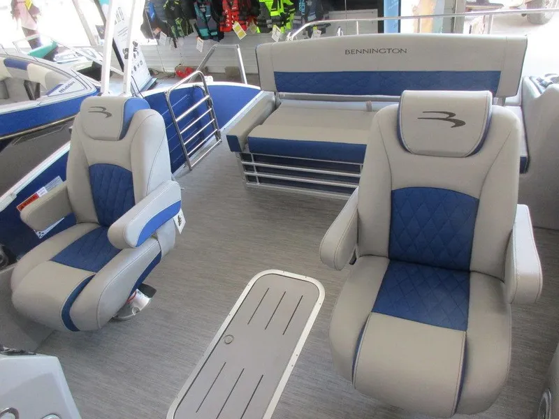 Slide: The Image of 2023 Bennington 25 LTSB boat interior with blue and gray seating. - 8