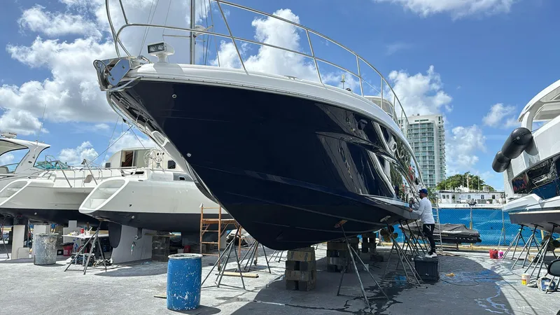 Slide: The Image of 2004 Sea Ray 500 Sundancer yacht in dry dock under maintenance. - 14
