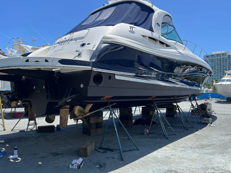 Slide: The Image of 2004 Sea Ray 500 Sundancer yacht on dry dock for maintenance. - 16