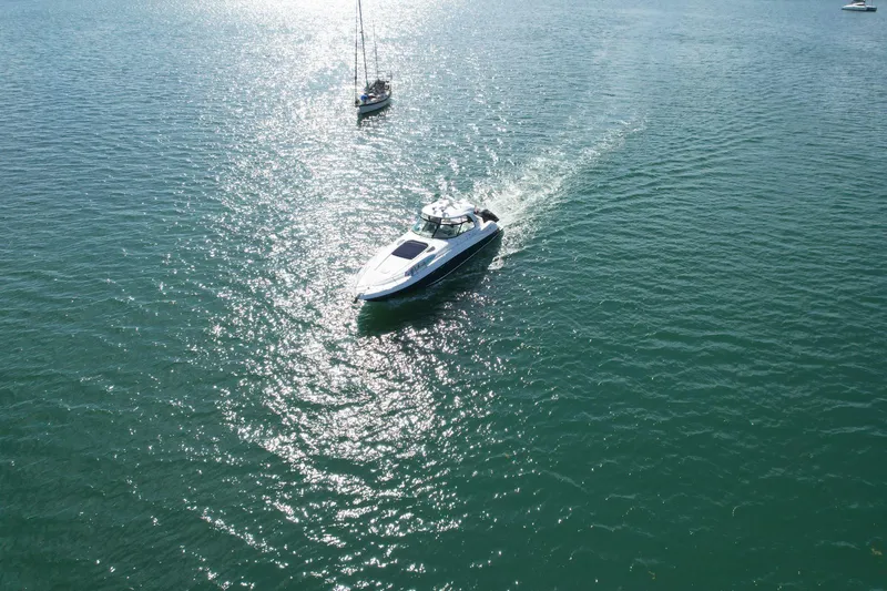 Slide: The Image of 2004 Sea Ray 500 Sundancer cruising on open water. - 28