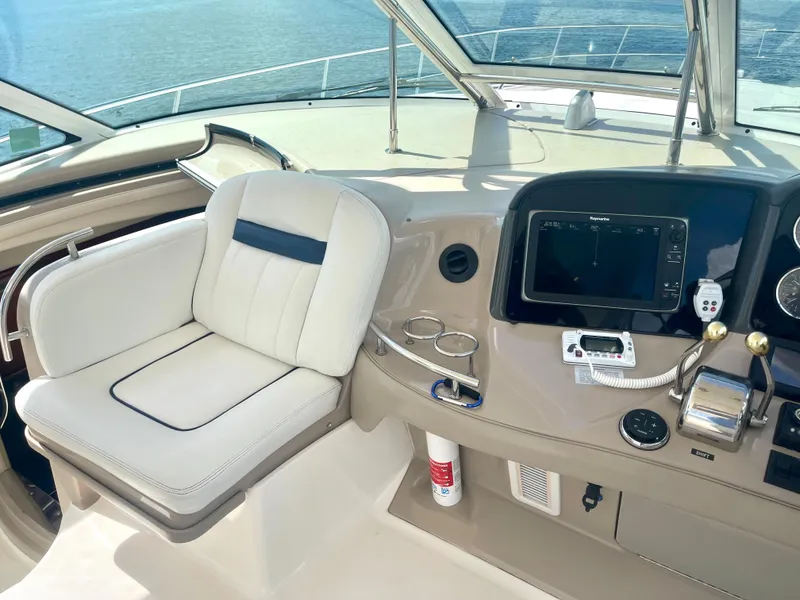 Slide: The Image of Helm of 2004 Sea Ray 500 Sundancer with navigation equipment and captain's chair. - 32