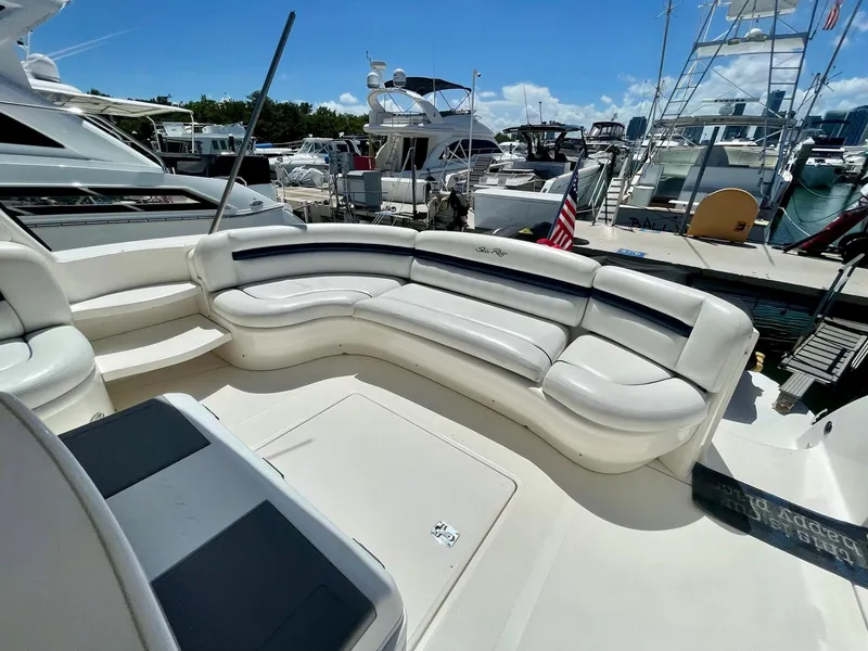 Slide: The Image of 2004 Sea Ray 500 Sundancer yacht with spacious outdoor seating at marina. - 40