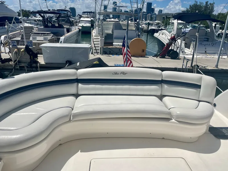 Slide: The Image of 2004 Sea Ray 500 Sundancer yacht with white seating at marina. - 42