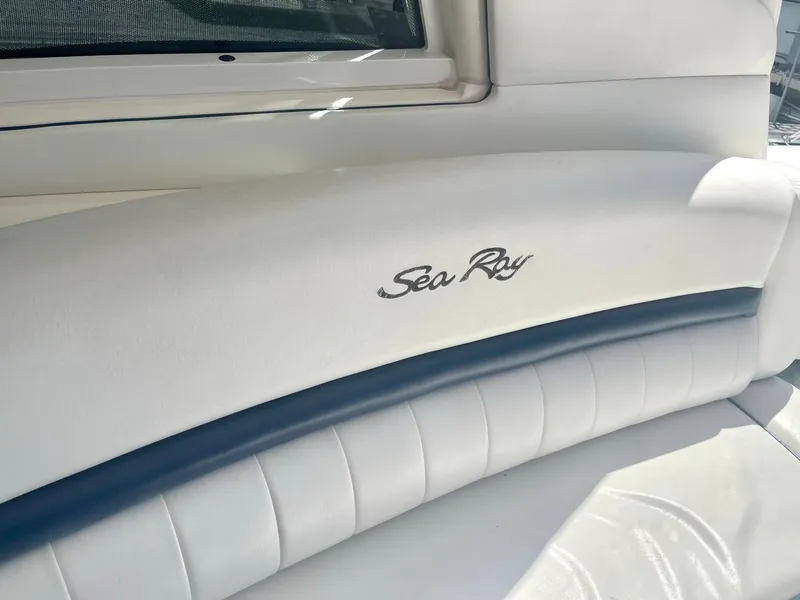 Slide: The Image of Sea Ray 500 Sundancer 2004 interior seating with logo detail. - 43