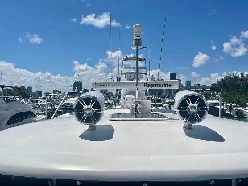 Slide: The Image of 2004 Sea Ray 500 Sundancer yacht with Raymarine equipment, docked under a clear blue sky. - 47
