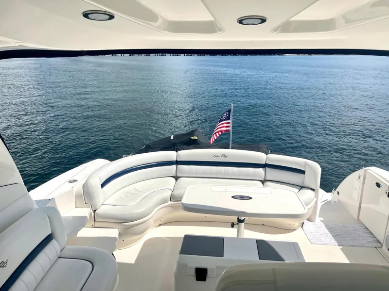 Slide: The Image of Luxury seating area on a 2004 Sea Ray 500 Sundancer yacht with ocean view. - 51