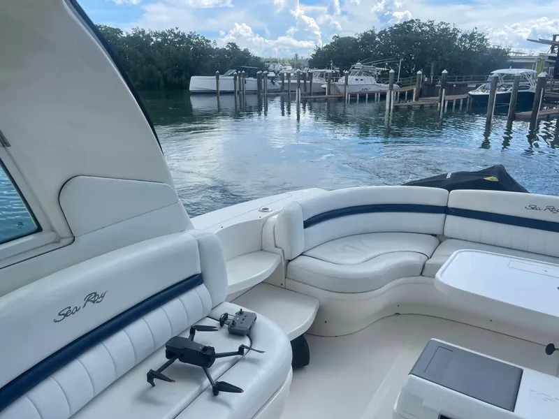 Slide: The Image of 2004 Sea Ray 500 Sundancer yacht interior with waterfront view. - 58