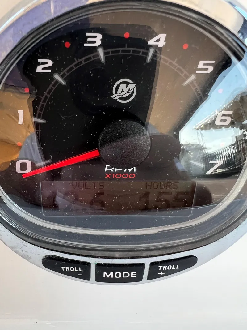 Slide: The Image of Close-up of a 2020 Protector 330 Targa boat tachometer displaying RPM and controls. - 15