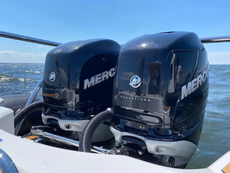 Slide: The Image of Twin Mercury outboard engines on a 2020 Protector 330 Targa boat. - 28