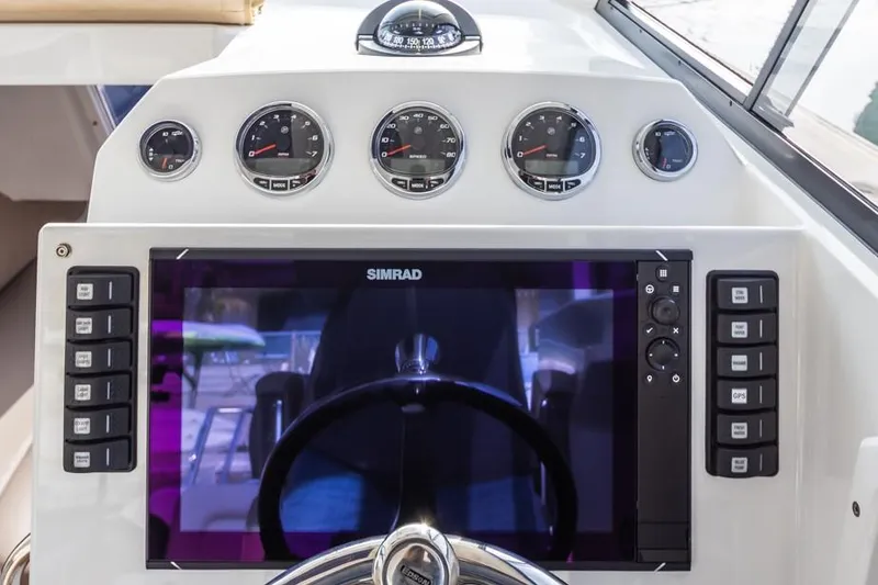 Slide: The Image of Dashboard of 2020 Protector 330 Targa boat with Simrad navigation system. - 36