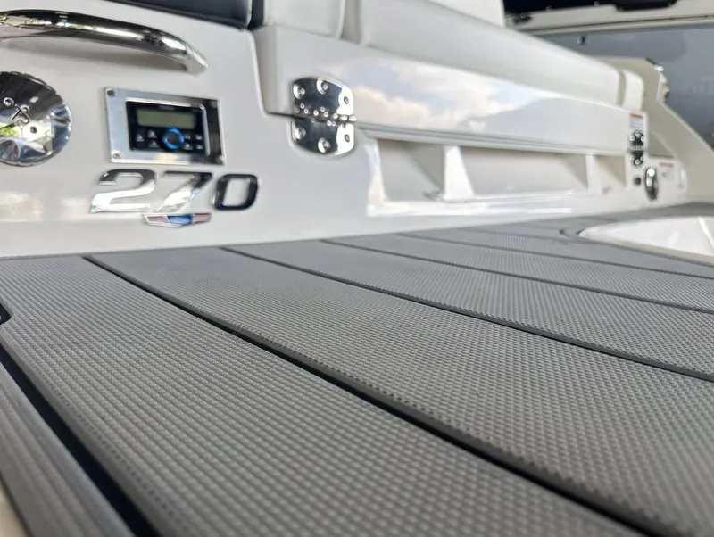 Slide: The Image of 2025 Chaparral 270 OSX OB boat deck with sleek design and modern features. - 11