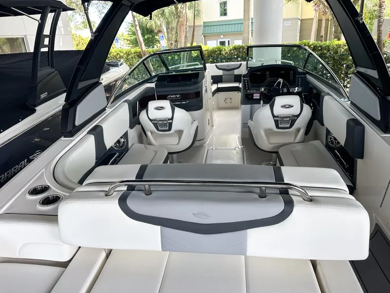 Slide: The Image of 2025 Chaparral 270 OSX OB boat interior with modern seating and dashboard. - 12