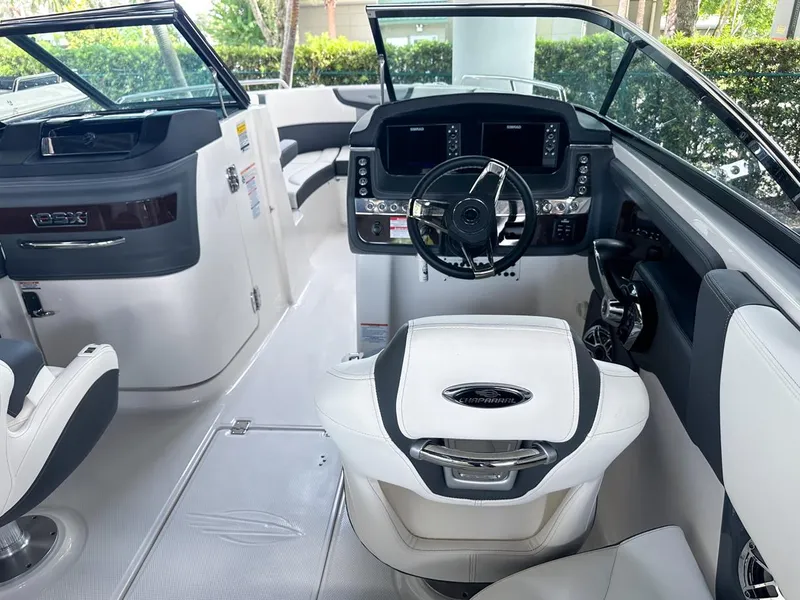 Slide: The Image of 2025 Chaparral 270 OSX OB boat interior with modern dashboard and steering wheel. - 14