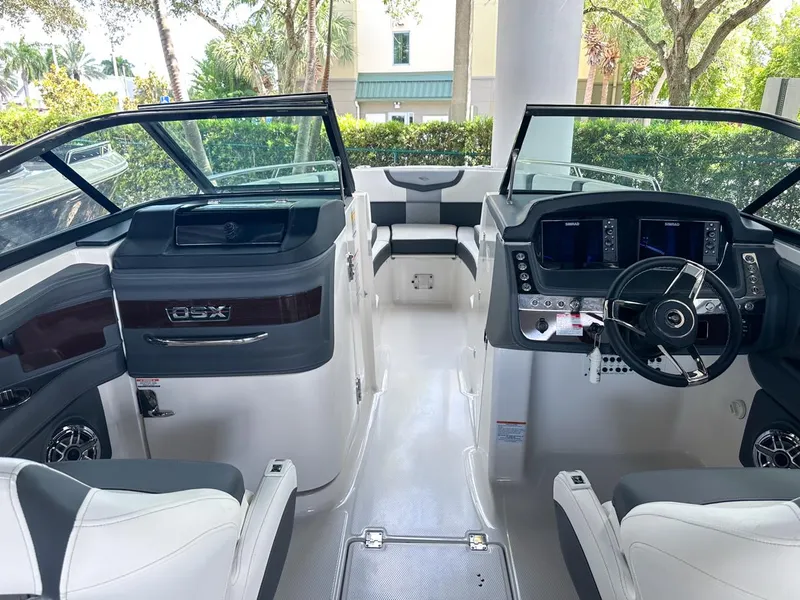 Slide: The Image of 2025 Chaparral 270 OSX OB boat interior with modern dashboard and seating. - 15