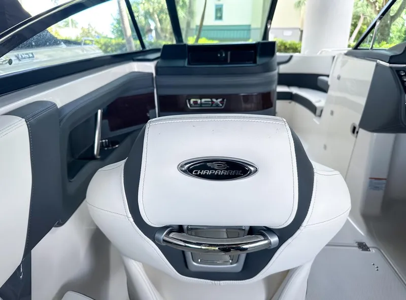 Slide: The Image of Interior of 2025 Chaparral 270 OSX OB boat, featuring sleek seating and modern design. - 17