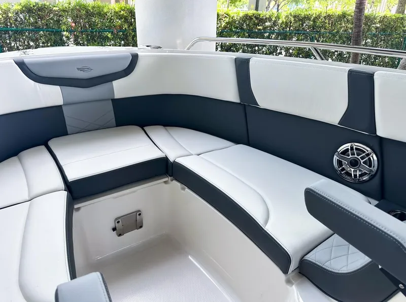 Slide: The Image of 2025 Chaparral 270 OSX OB boat interior with sleek seating and modern design. - 28