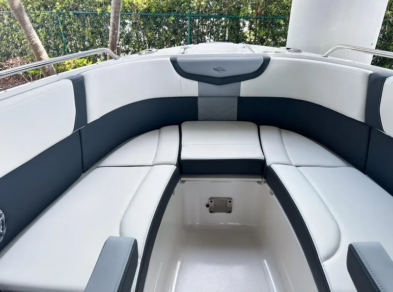 Slide: The Image of 2025 Chaparral 270 OSX OB boat interior with sleek, modern seating design. - 29