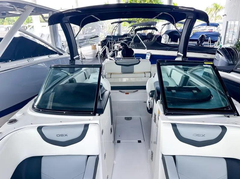 Slide: The Image of 2025 Chaparral 270 OSX OB boat interior with sleek design and modern features. - 31