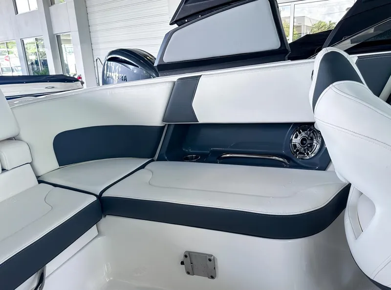 Slide: The Image of 2025 Chaparral 270 OSX OB boat interior with sleek seating and modern design. - 33